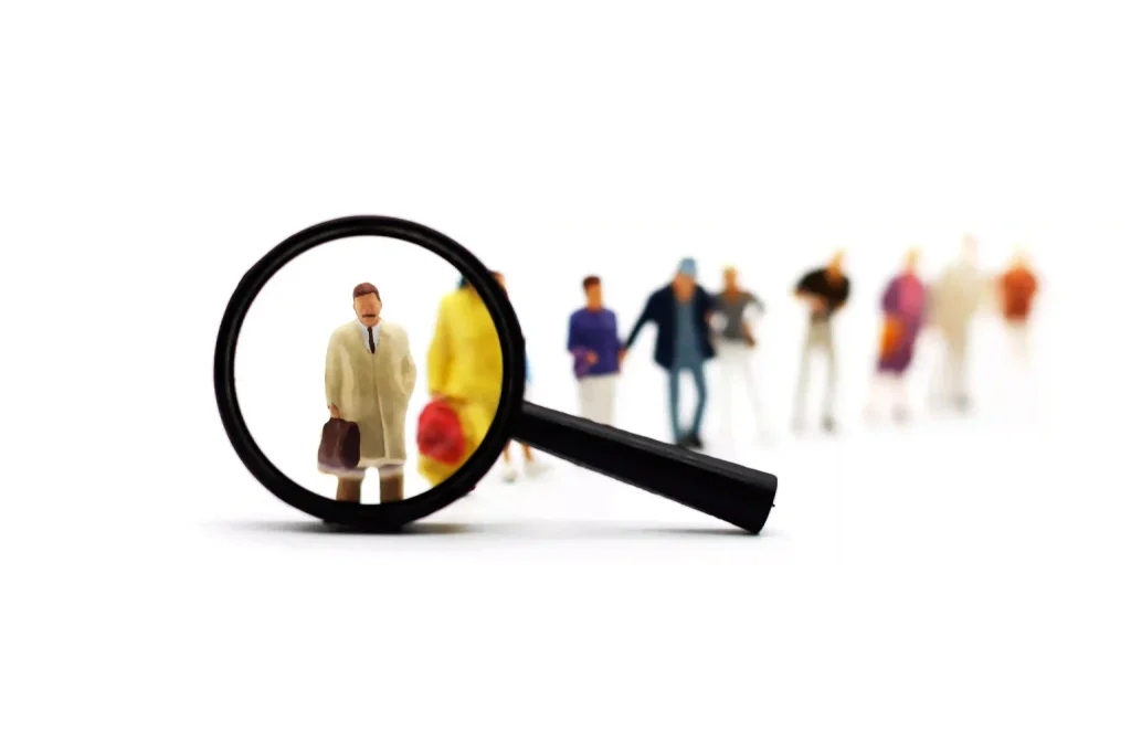 Magnifying glass identifying HR talent and career candidates